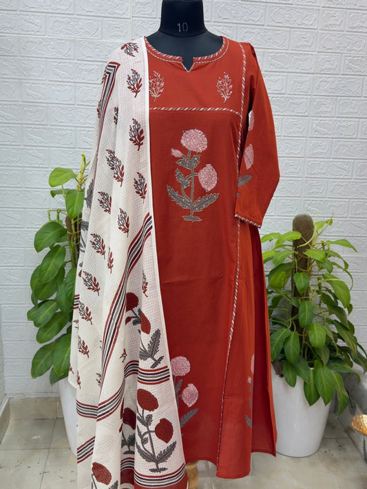 Description Premium Floral Embroidered Cotton Suit Set with Contrast Dupatta – Rust Red